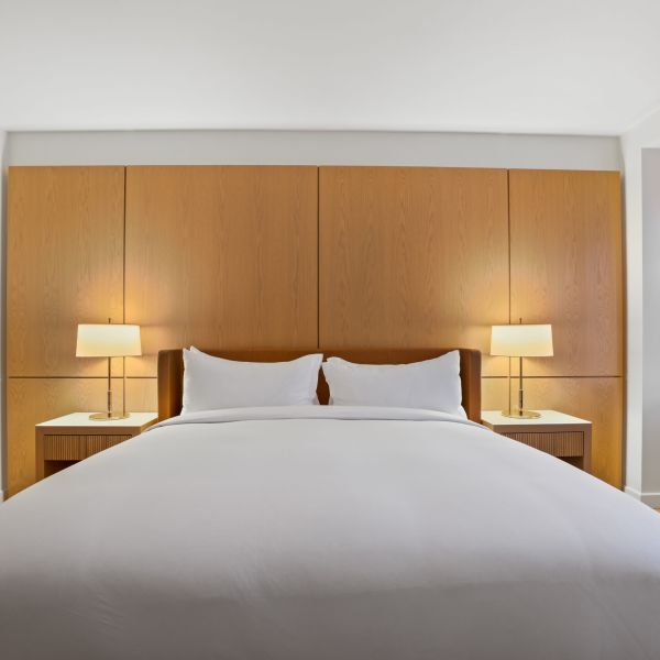 commercial boutique hotel room bed and headboard focus