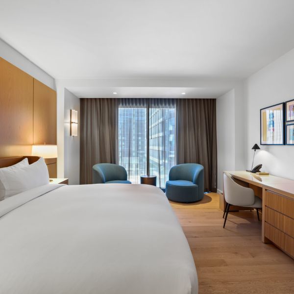 commercial boutique hotel room long view towards window